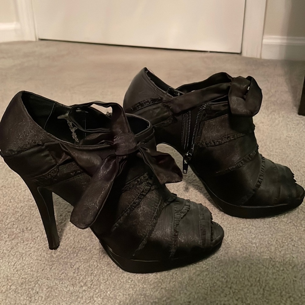Black high heel booties satin